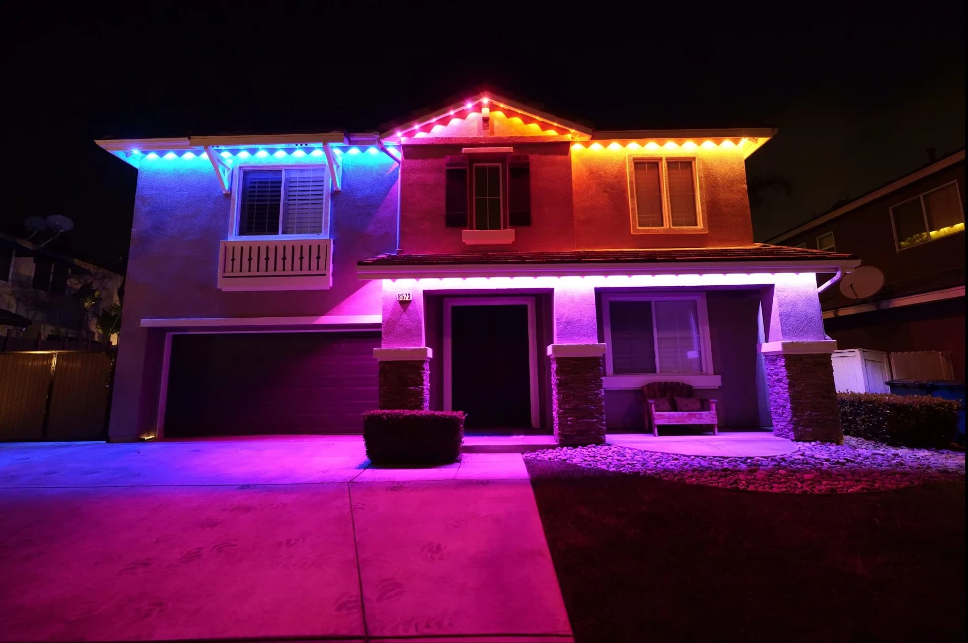 Home with Lumeva permanent lighting at twilight, roofline aglow